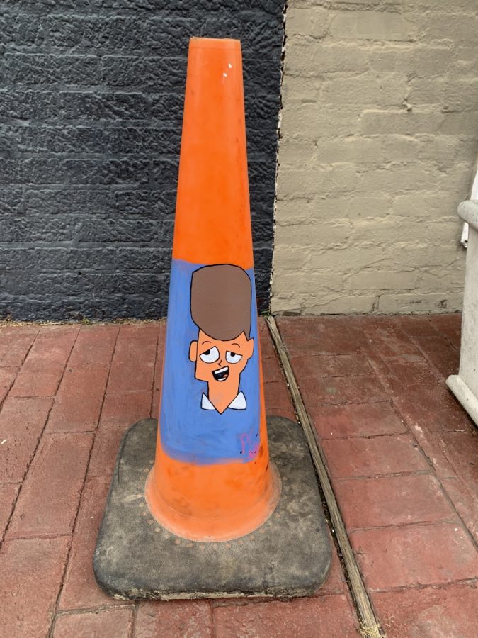 A painted traffic cone by PC, showing that not all graffiti is bad and offensive.